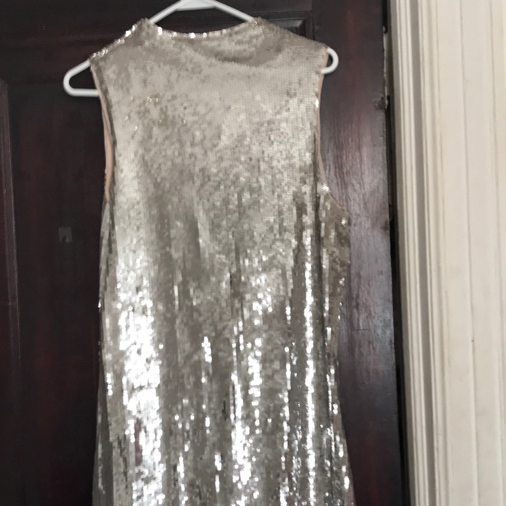New with tags sleeveless, silver sequined dress.